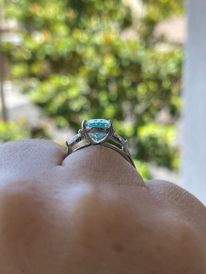 3 carat pear shaped engagement ring with blue crushed ice aquamarine simulated diamond in sterling silver or yellow gold vermeil