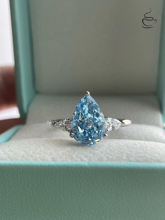 3 carat pear shaped engagement ring with blue crushed ice simulated diamond in sterling silver or yellow gold vermeil