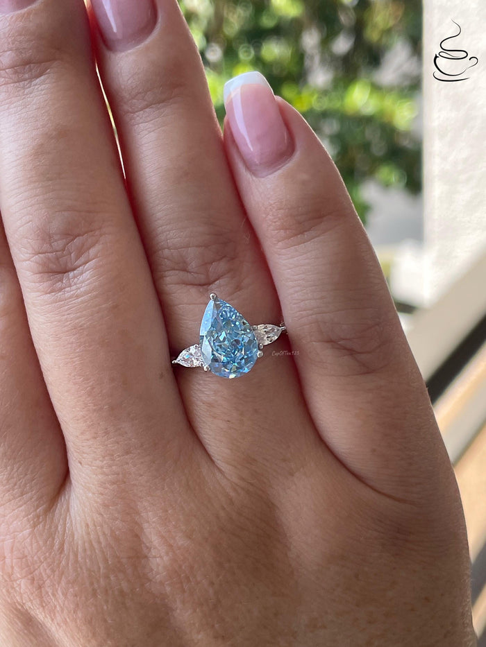 3 carat pear shaped engagement ring with blue crushed ice simulated diamond in sterling silver or yellow gold vermeil