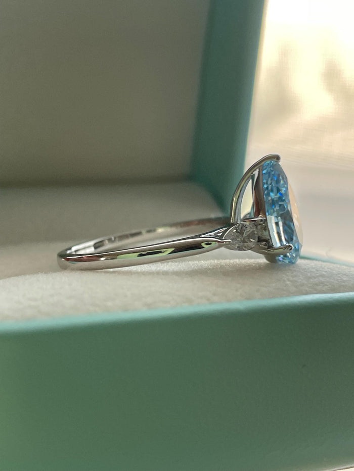 3 carat pear shaped engagement ring with blue crushed ice simulated diamond in sterling silver or yellow gold vermeil