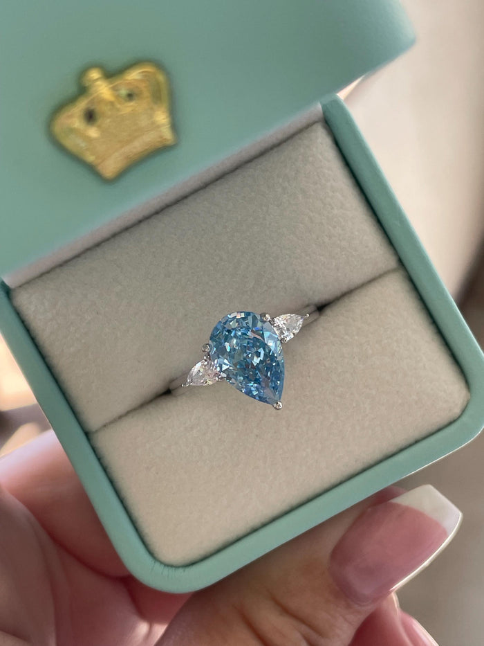 3 carat pear shaped engagement ring with blue crushed ice simulated diamond in sterling silver or yellow gold vermeil