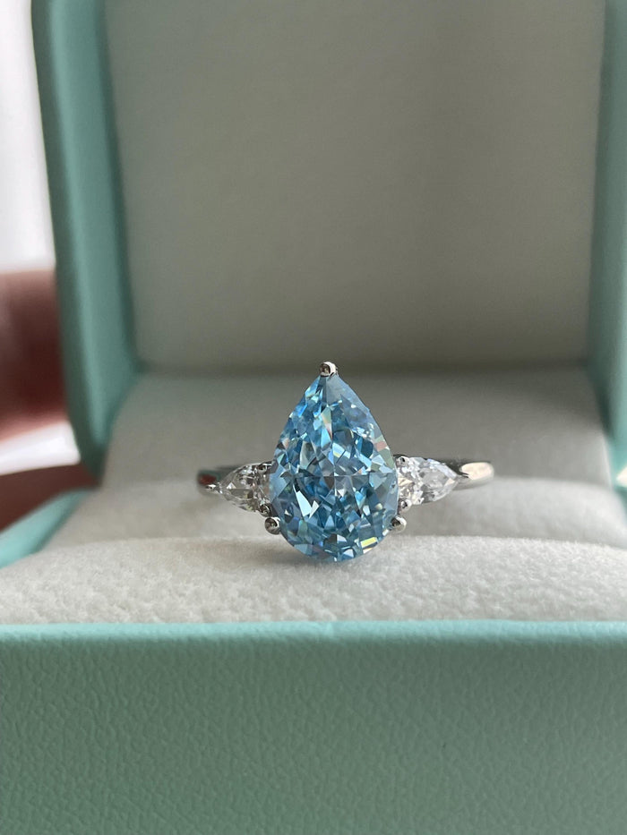 3 carat pear shaped engagement ring with blue crushed ice simulated diamond in sterling silver or yellow gold vermeil