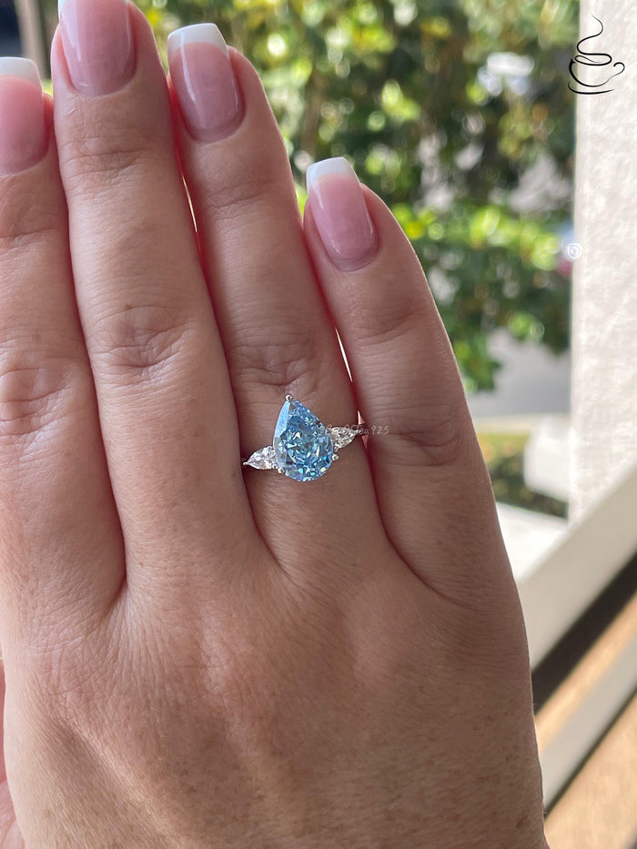 3 carat pear shaped engagement ring with blue crushed ice simulated diamond in sterling silver or yellow gold vermeil