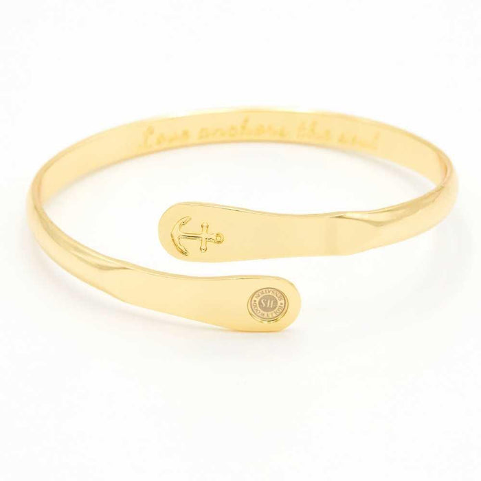 Gold anchor engraved cuff bracelet with oval charm plate and round seal