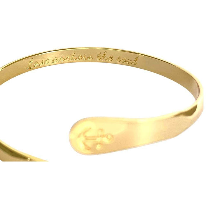 Gold anchor cuff bracelet with engraved inner message along the band