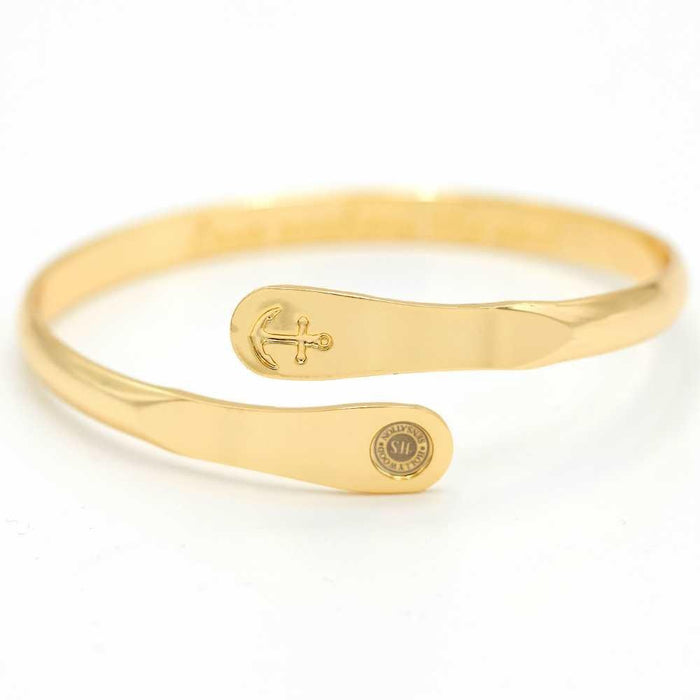 Gold anchor cuff bracelet with oval front plate and small round seal