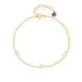 Gold-tone bracelet with clear oval cubic zirconia charms and round link chain