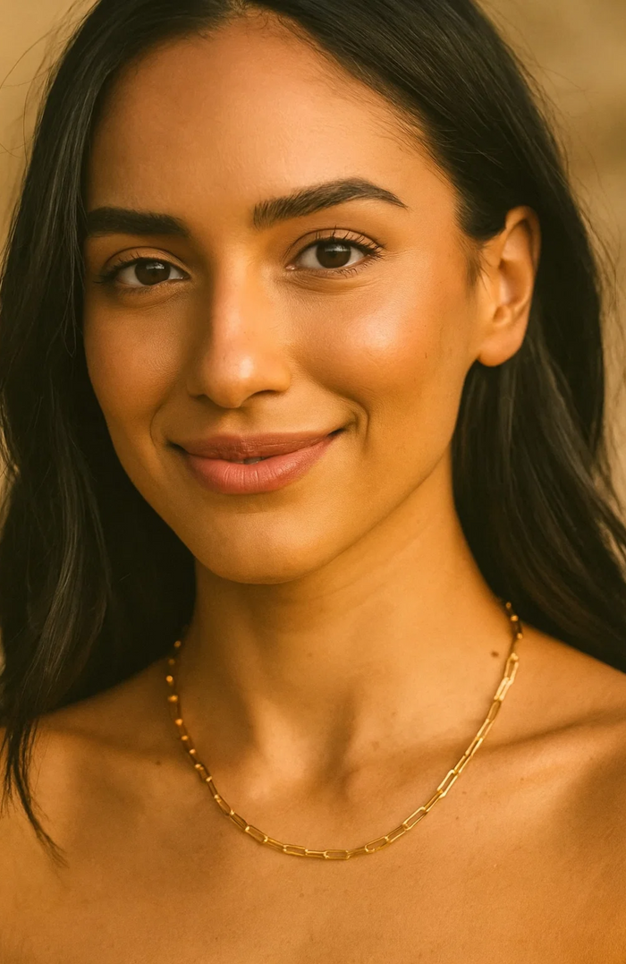 Gold paperclip-link necklace on model, short choker length
