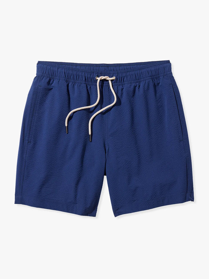 Bayberry swim trunks in Navy blue seersucker with a drawstring waistband and pockets on the sides.