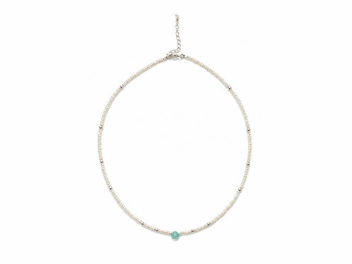 A delicate silver beaded choker necklace with a single small round turquoise gemstone at the front center, displayed on a clean white background.