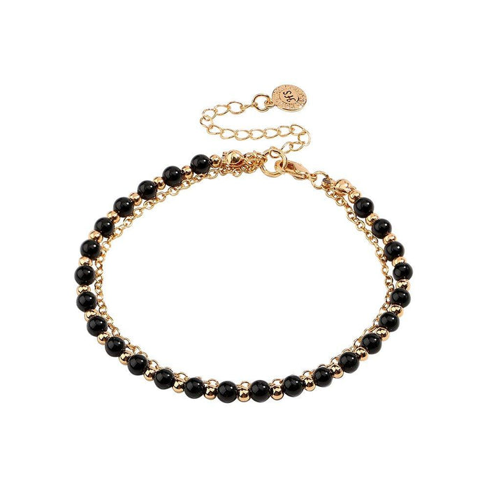 Gold beaded friendship bracelet with black bead rows and small round charm