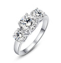 Three-stone cubic zirconia ring with round clear stones in silver-tone setting