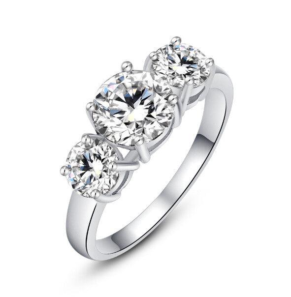 Three-stone cubic zirconia ring with round clear stones in silver-tone setting