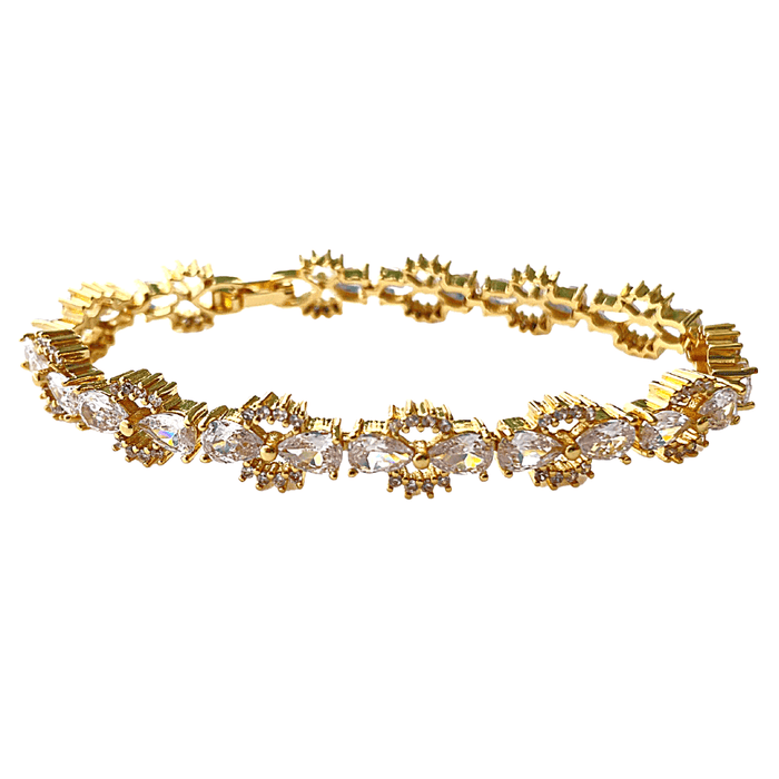Gold tennis bracelet with bow-tie cubic zirconia links and clear stones