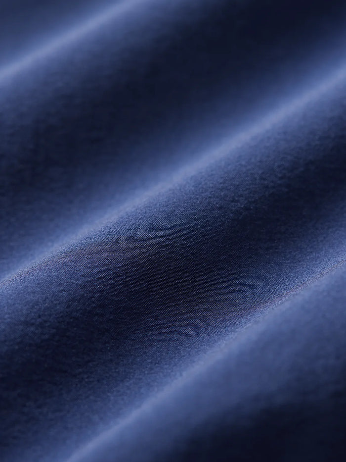 Swatch of navy blue bungalow fabric.