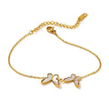 Gold chain bracelet with three butterfly charms and white shell inlay accents