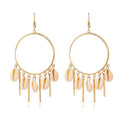 Gold hoop chandelier earrings with peach puka seashells and dangling charms