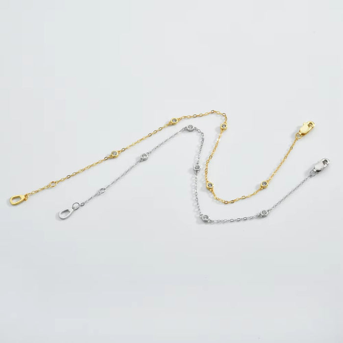 Gold and silver cubic zirconia bezel link bracelets with round stones and clasps