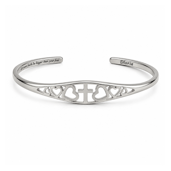 Silver adjustable cuff bracelet featuring engraved cross and heart filigree and inner quote