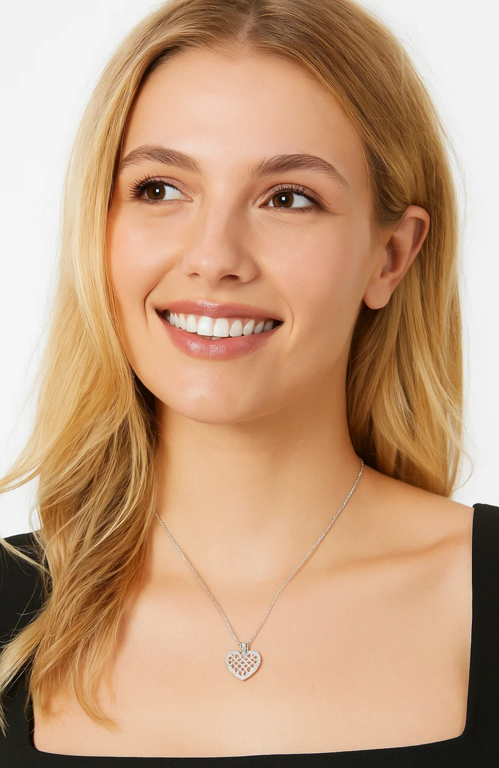 Crystal heart necklace with silver chain and pavé heart pendant on model