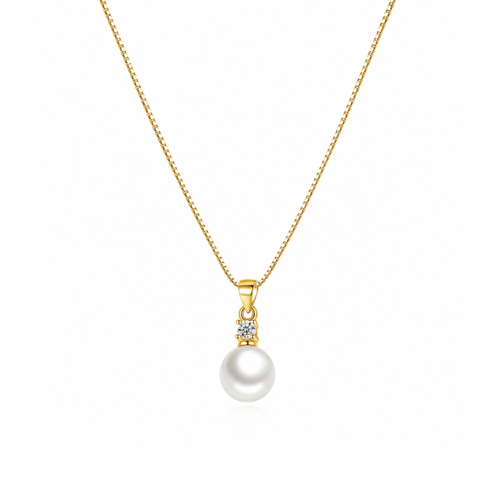 Gold-tone pendant necklace with faux pearl drop and cubic zirconia charm on chain
