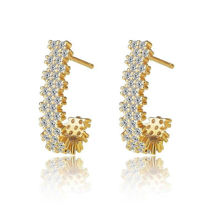 Gold-tone J hoop earrings with clear cubic zirconia stones and dangling charm
