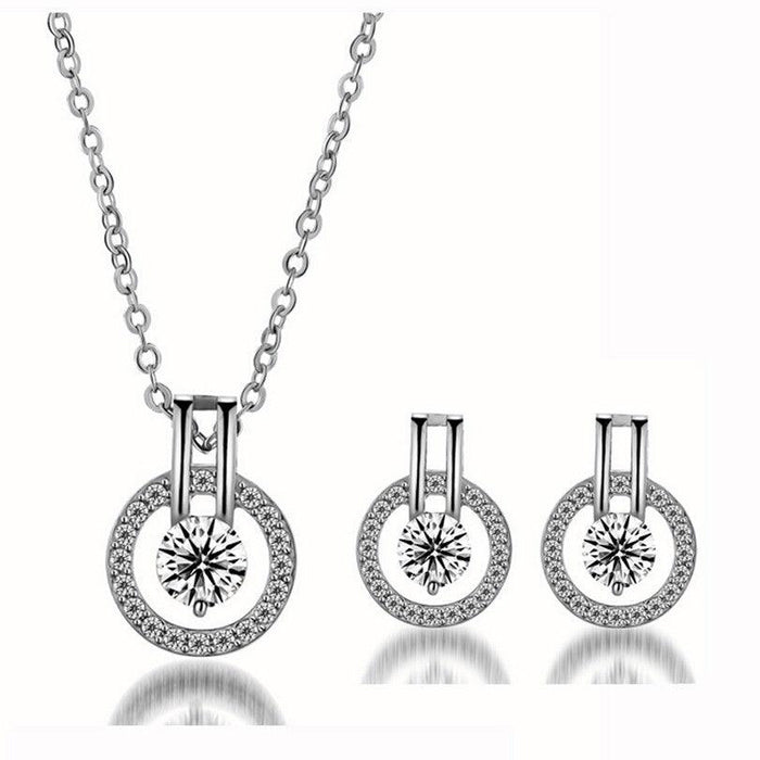 Silver cubic zirconia pendant necklace with round halo and matching round stud earrings