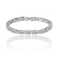 Silver-tone tennis bracelet with oval and round cubic zirconia stones, clasp detail