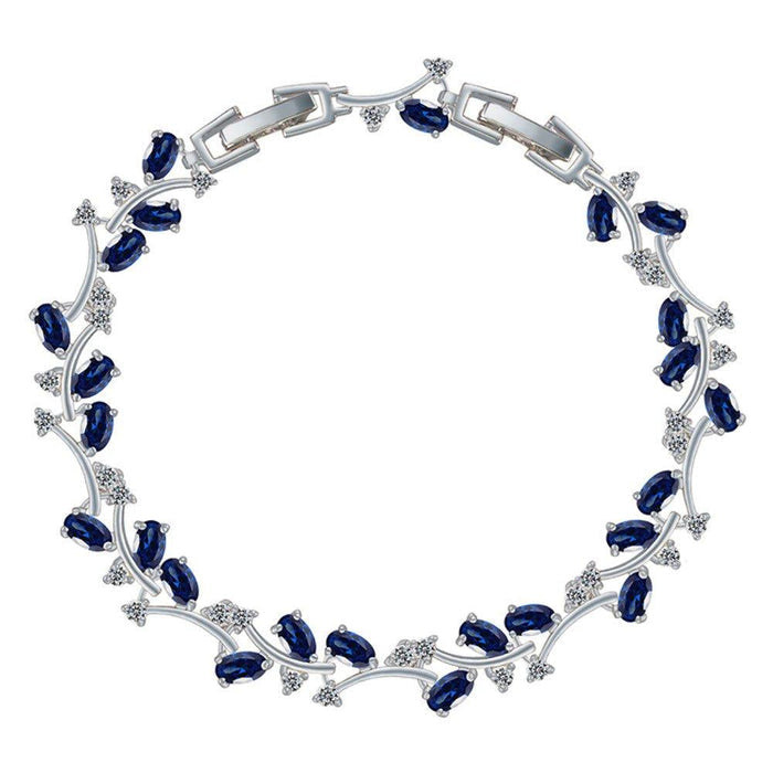 Sapphire blue tennis bracelet with oval CZ stones and silver-tone link frame