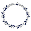Sapphire blue tennis bracelet with oval CZ stones and silver-tone link frame