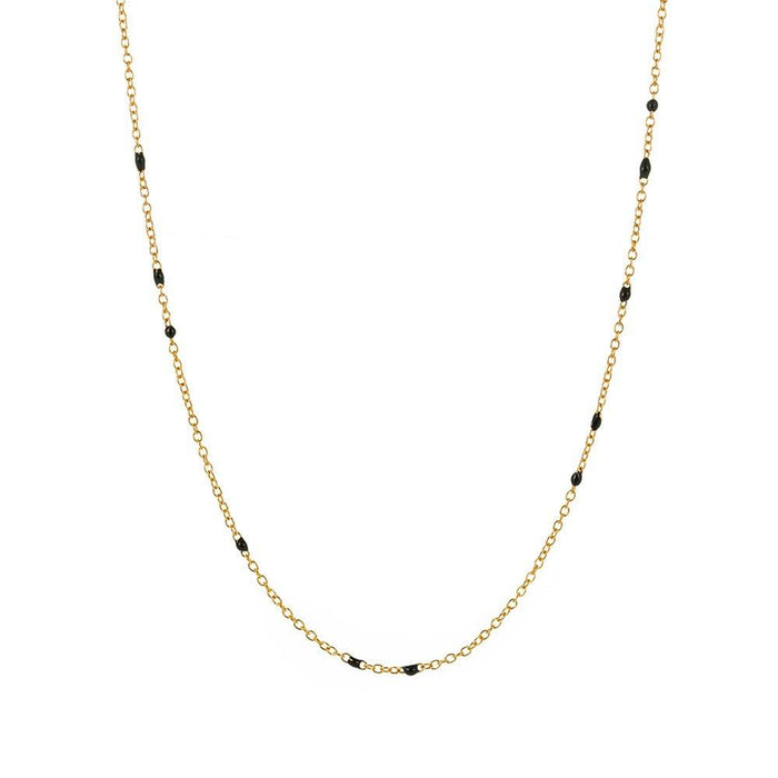 Gold link necklace with small black bead accents along the chain