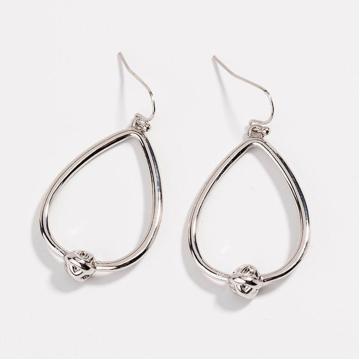 Silver teardrop hoop earrings with love-knot charm at the bottom