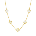 Gold-tone necklace with five small flower charms on a fine chain, front view