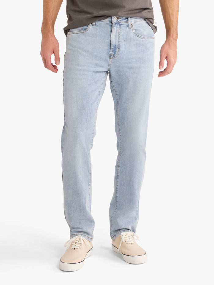Light blue jeans from Fair Harbor worn by a person on a white background