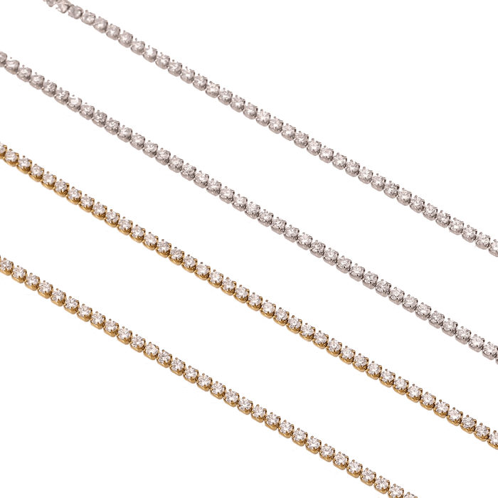 Two cubic zirconia tennis necklaces in gold and silver tones, each with a stone row