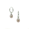 Eternal Summer Sunset Pearl Sleepers Silver crafted in premium 925 sterling silver featuring genuine soft pink freshwater pearl drops suspended from polished sleeper hoops.
