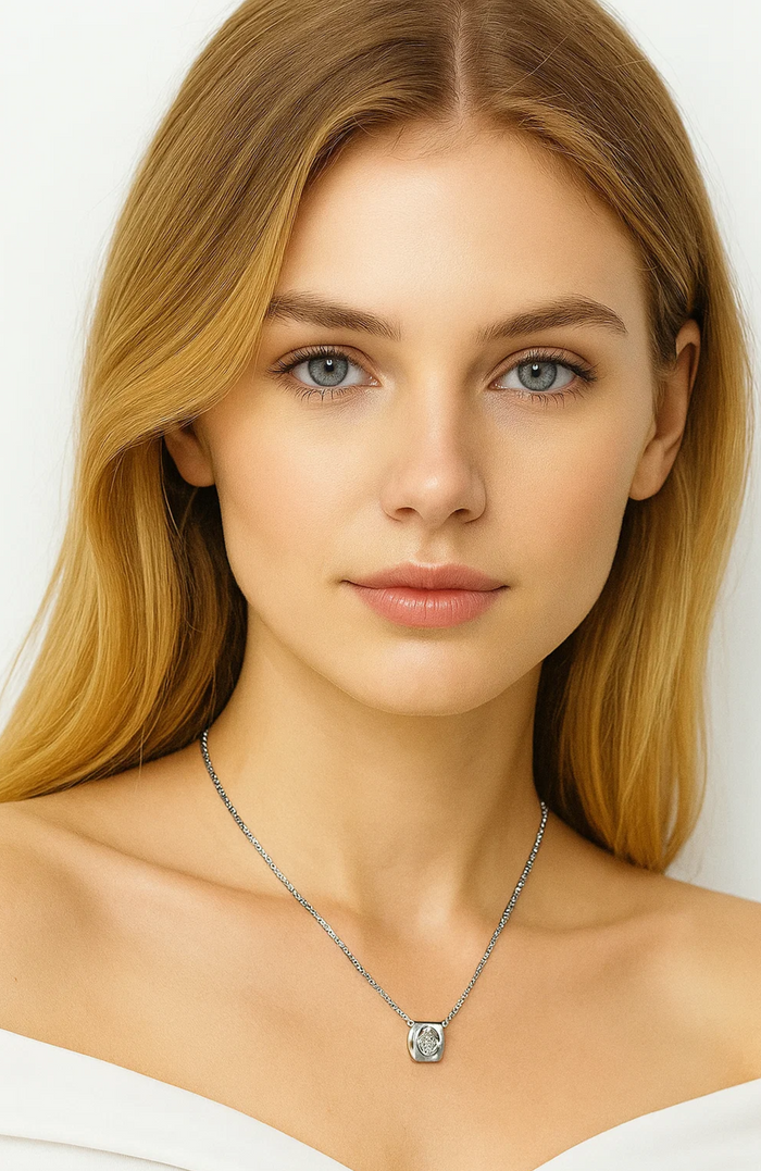 Heart pendant necklace with clear round zirconia stone on a delicate silver-tone chain