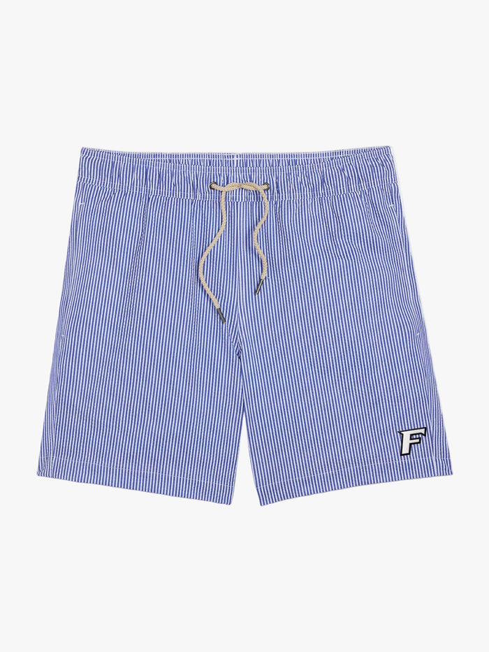 Blue and white pinstriped swim trunks with a beige drawstring and a small white embroidered letter 'F' logo on the lower left leg, shown flat on a white background.