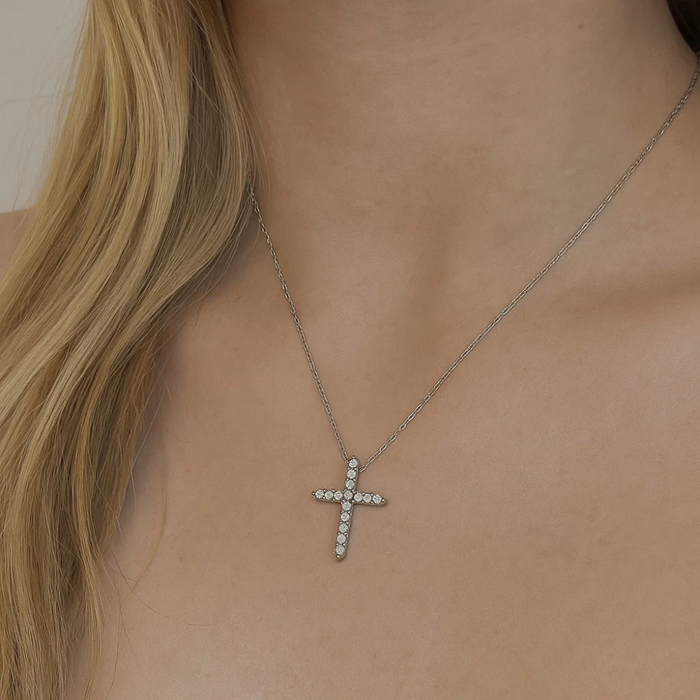 Cubic zirconia cross pendant necklace on a silver-tone chain