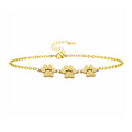 Gold paw print charm bracelet with three dangling paw charms
