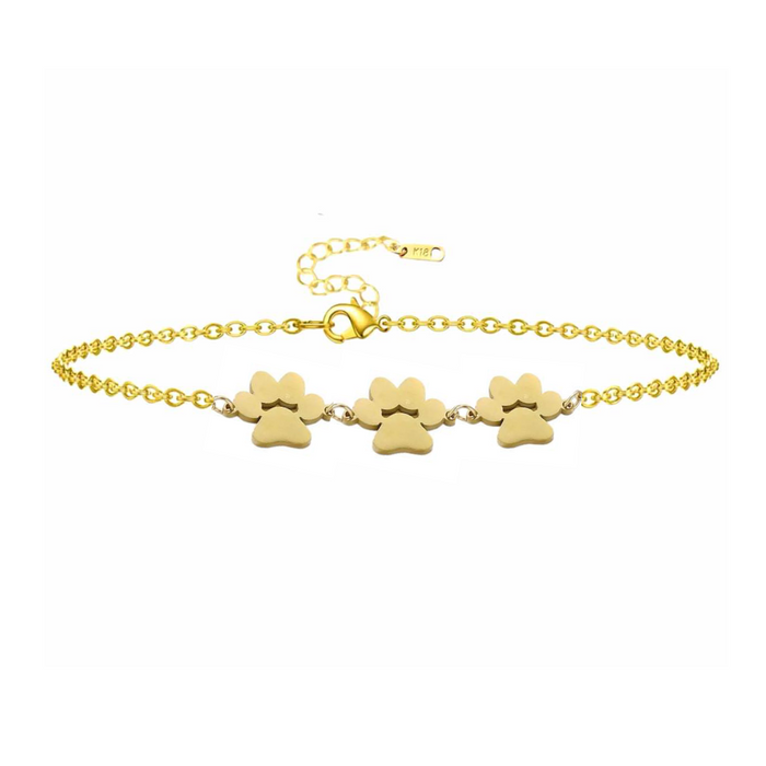 Gold paw print charm bracelet with three dangling paw charms