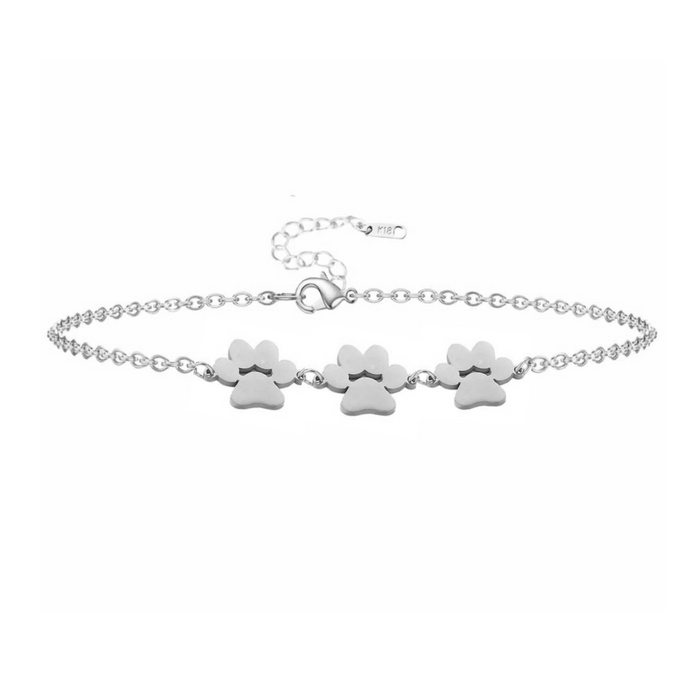 Silver paw print charm bracelet with three dangling paw charms
