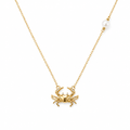 Gold-tone necklace with crab pendant and small pearl bead, dainty chain