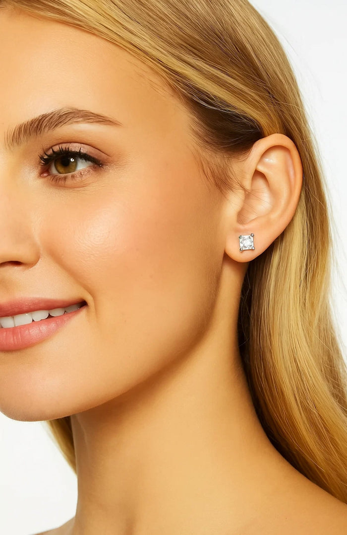 Close-up of ear with princess-cut cubic zirconia stud earrings