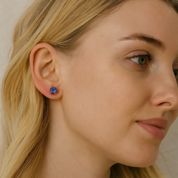 Round prong-set rainbow gemstone stud earrings on ear, silver-tone setting