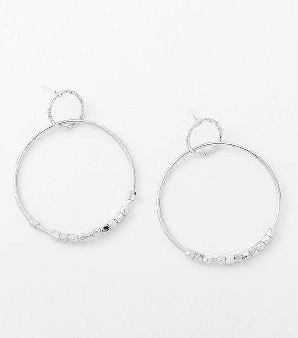 Silver hoop dangle earrings set with thin hoops and bead-link chain across bottom