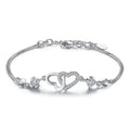 Silver-tone heart bracelet with cubic zirconia and toggle clasp