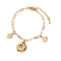 Gold-tone link charm bracelet with star charms and round locket pendant