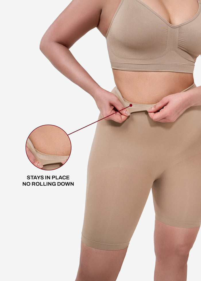 A lady showing the feature of high waisted shaper shorts