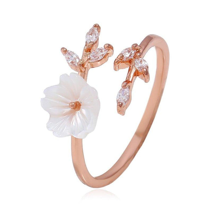 Rose gold cherry blossom ring with white flower and marquise-cut stones